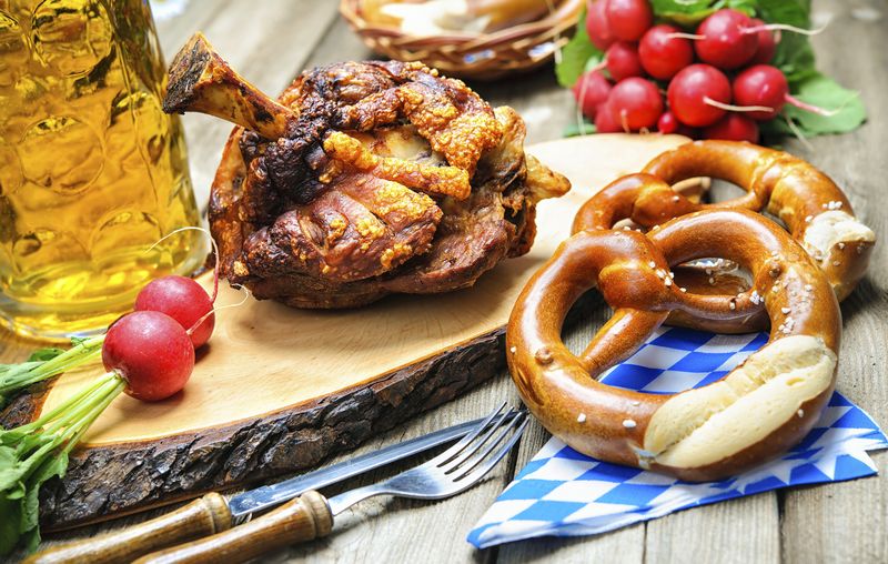 Roasted pork knuckle with pretzels and beer. Oktoberfest